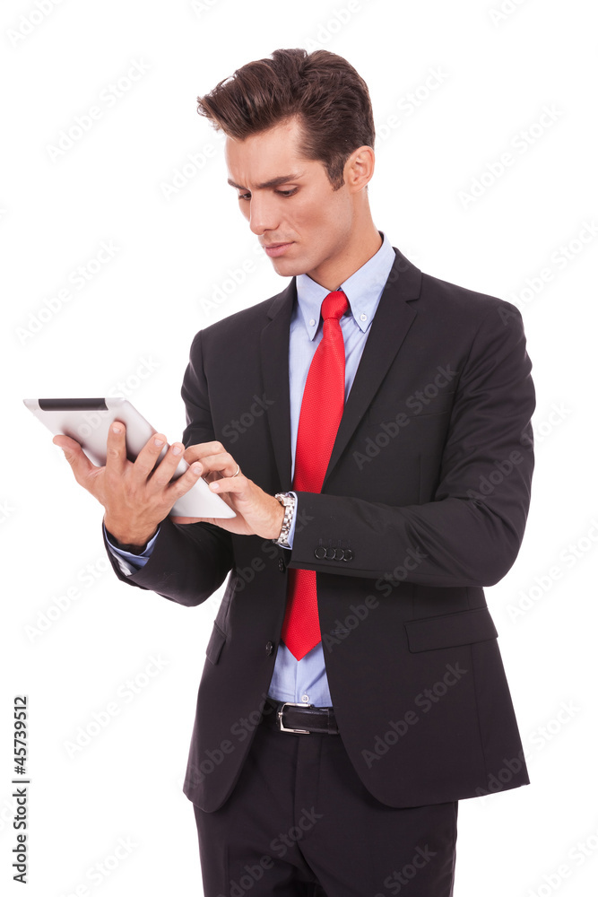 young business man working on his tablet pad young business man working on his tablet pad