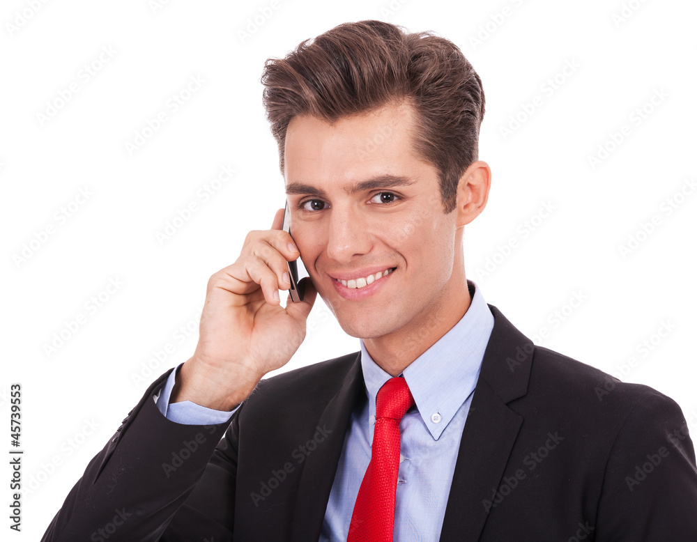 smiling business man talking on his smartphone smiling business man talking on his smartphone