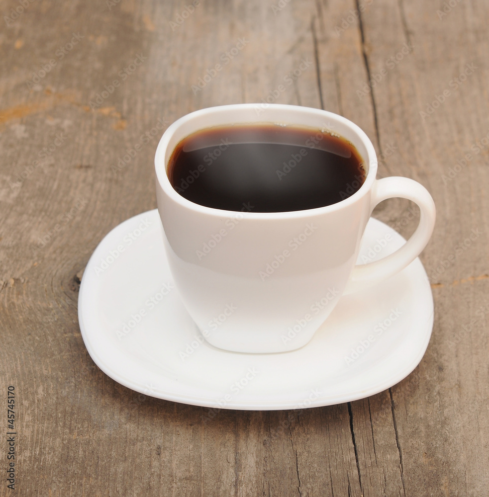 cup of coffee with smoke on brown background cup of coffee with smoke on brown background