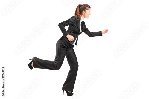 Full length portrait of a businesswoman in hurry running