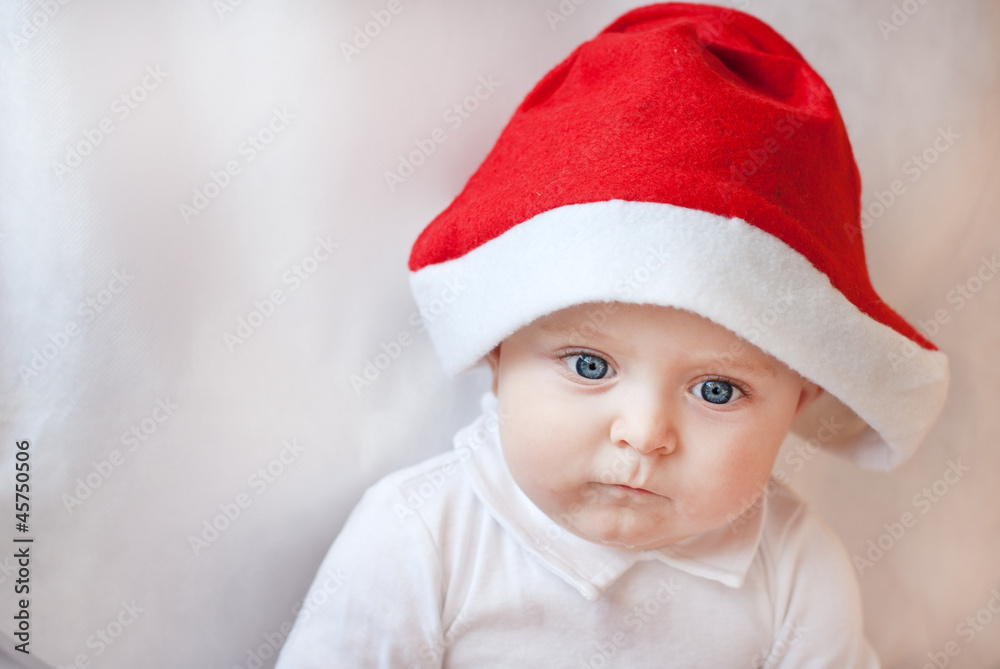 Baby boy with Christmas cap and balls Baby boy with Christmas cap and balls