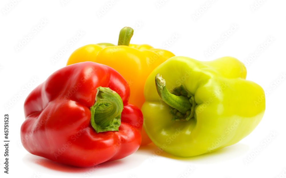 fresh yellow, red and green bell peppers isolated on white fresh yellow, red and green bell peppers isolated on white