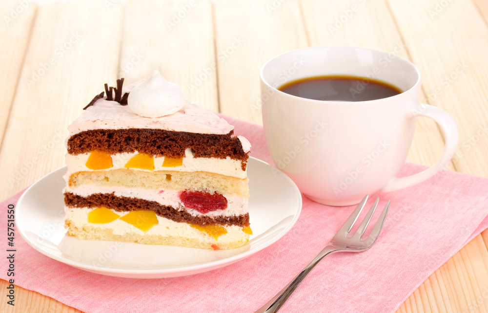 Layered fruit cake on wooden table Layered fruit cake on wooden table