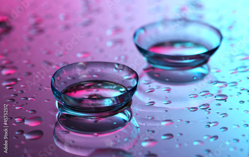 contact lenses, on pink-blue background
