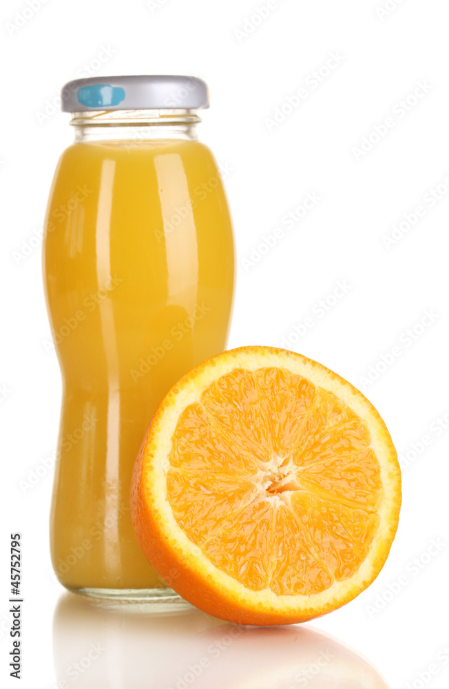 Delicious orange juice in a bottle and orange next to it Delicious orange juice in a bottle and orange next to it