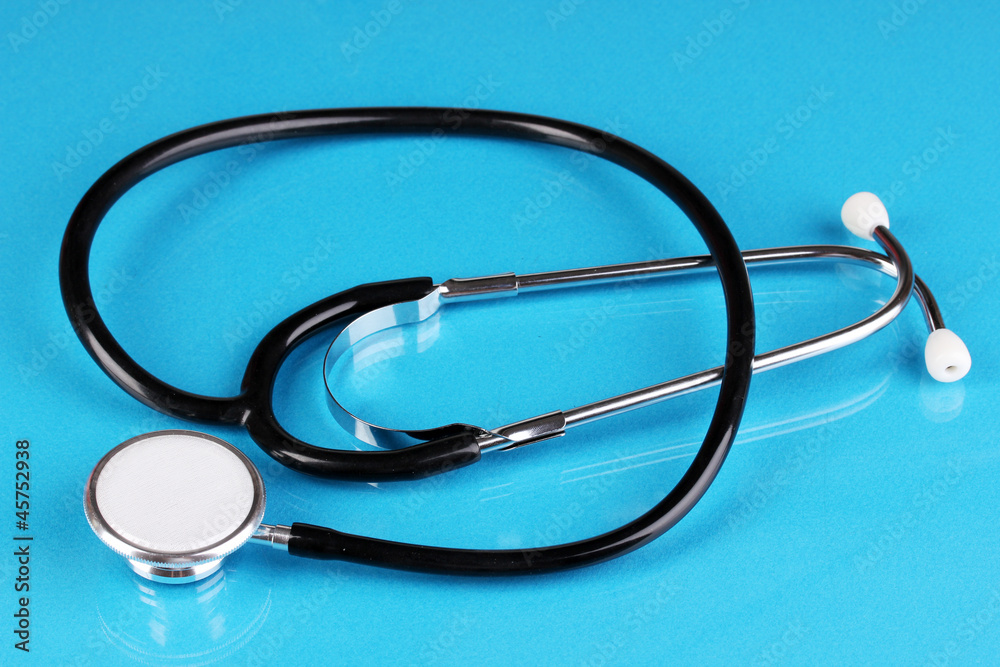 Stethoscope on blue background