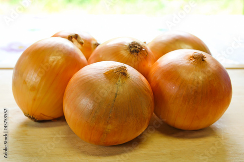 onions on a kitchen cutting board