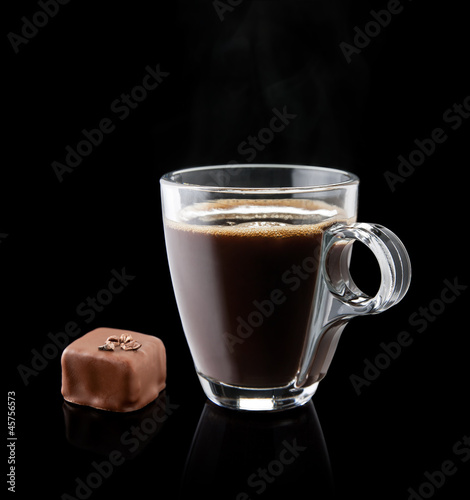 cup of coffee with a chocolate bonbon photo