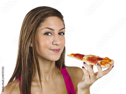 pretty teenage girl holding a slice of pizza