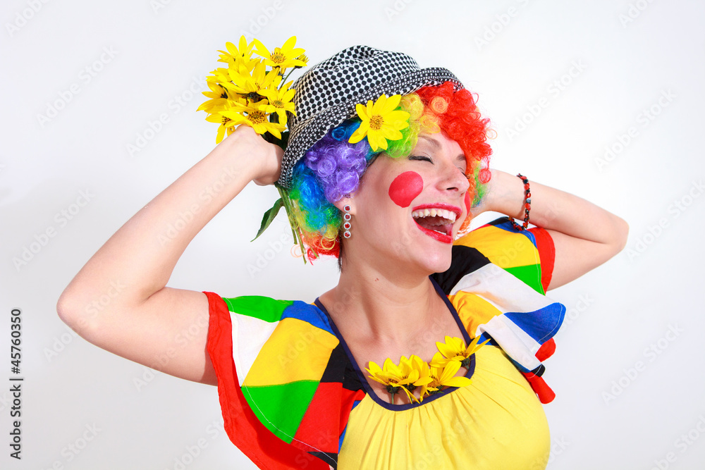 Clown looking to the copy space area in a white studio Clown looking to the copy space area in a white studio
