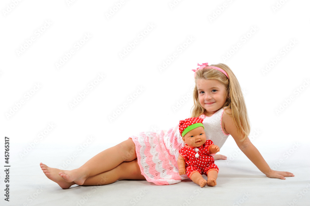 Pretty blonde girl and doll