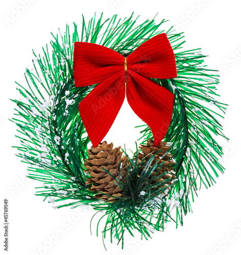 Christmas wreath with cones and red bow  isolated on white