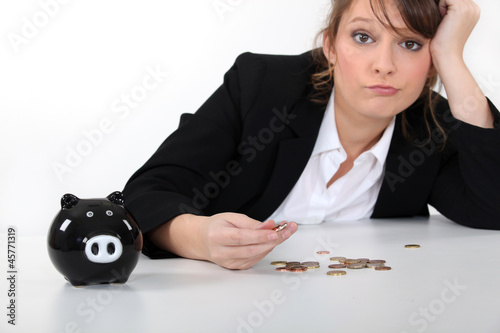 Woman counting coins photo