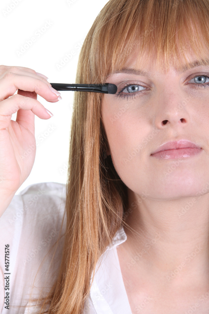 Female making up eyes Female making up eyes