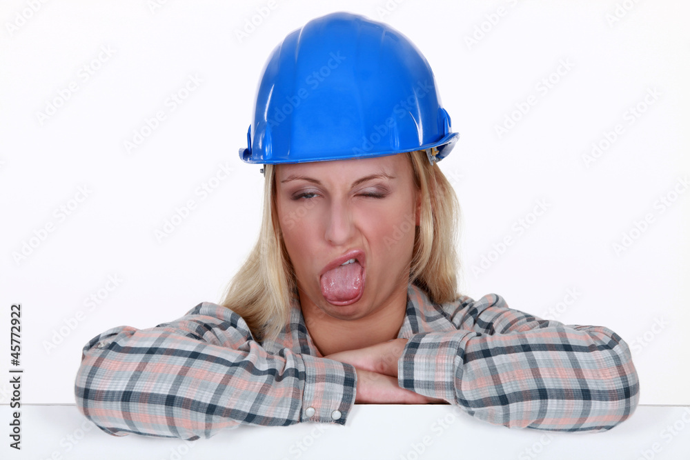 Female construction worker pulling a silly face Female construction worker pulling a silly face