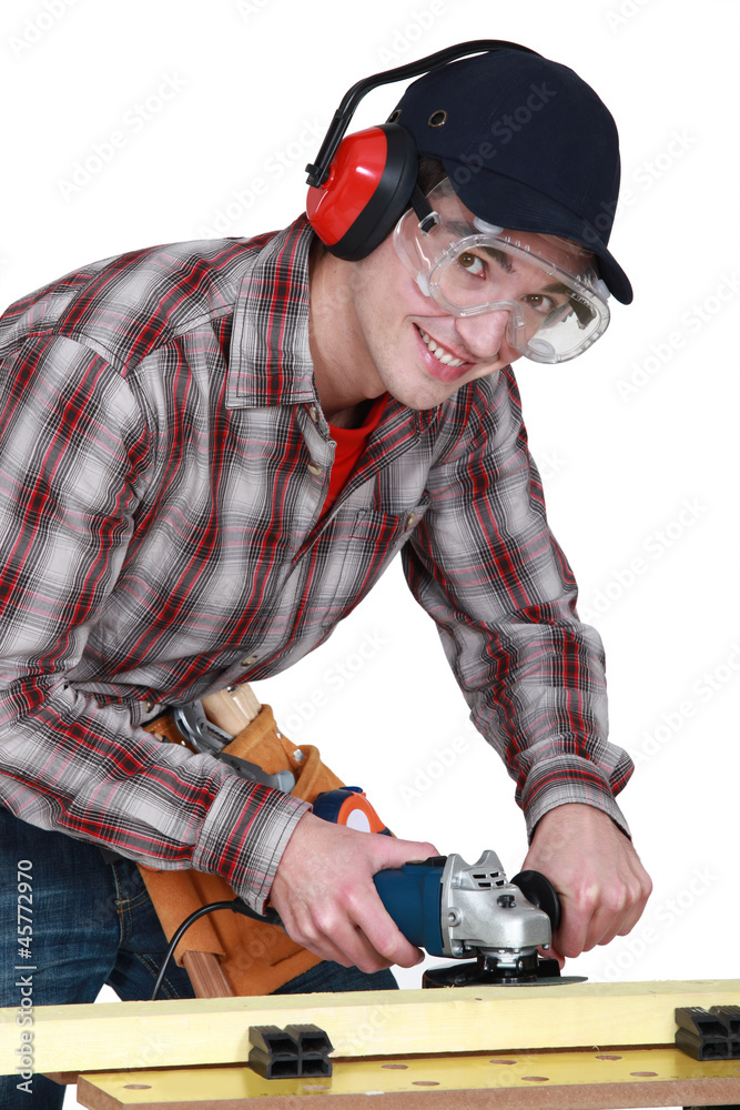 young carpenter at work on workbench young carpenter at work on workbench