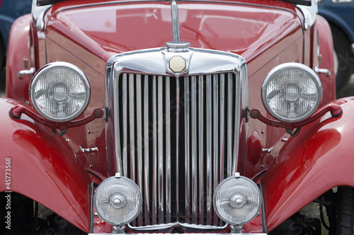 Front of old red car, closeup © Garlezki