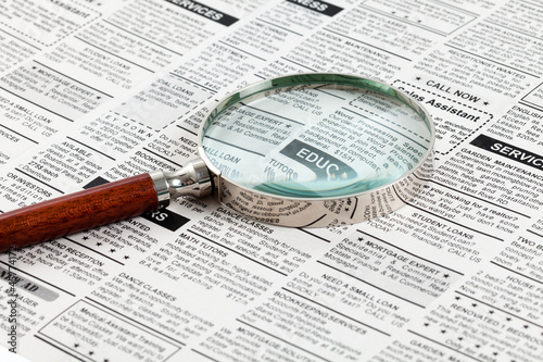 Classified Ad and magnifying glass