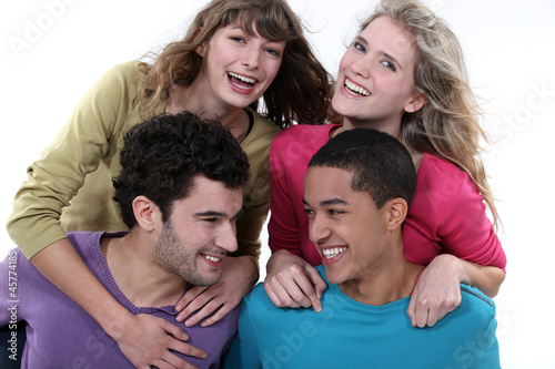 Konstfotografi elated young foursome of students