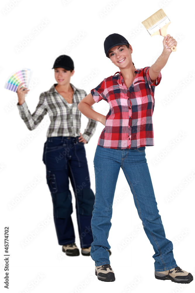Fototapeta premium Two female decorators choosing paint color