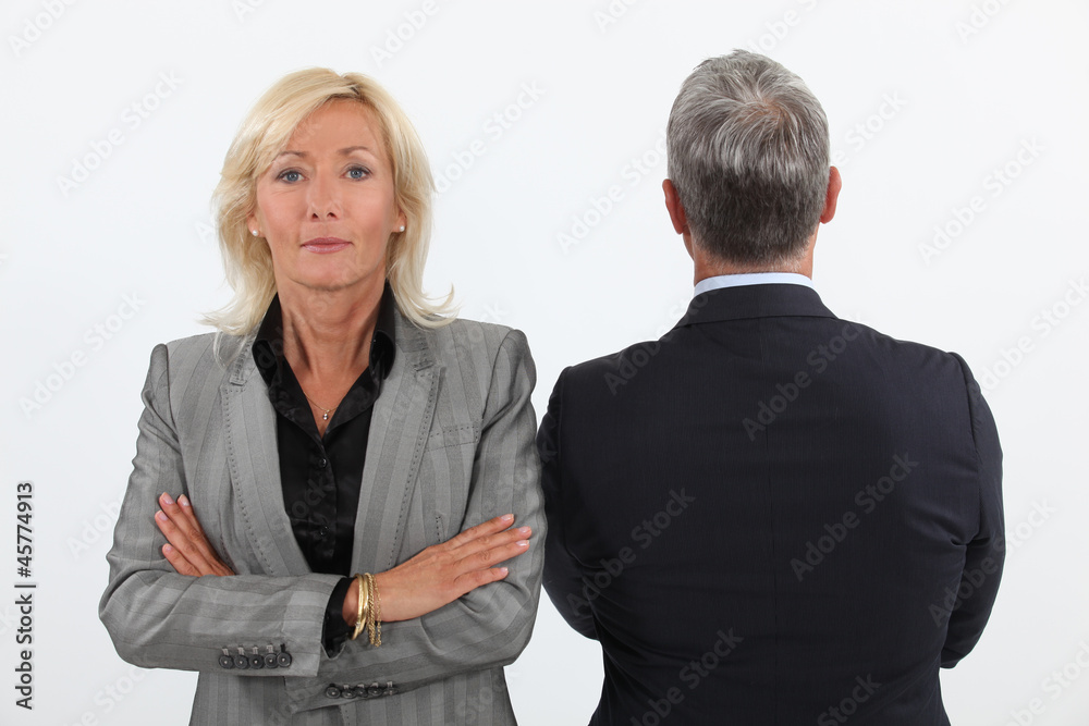 Smart mature businesswoman next to businessman Smart mature businesswoman next to businessman