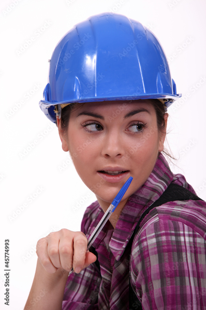 A portrait of a female construction worker. A portrait of a female construction worker.