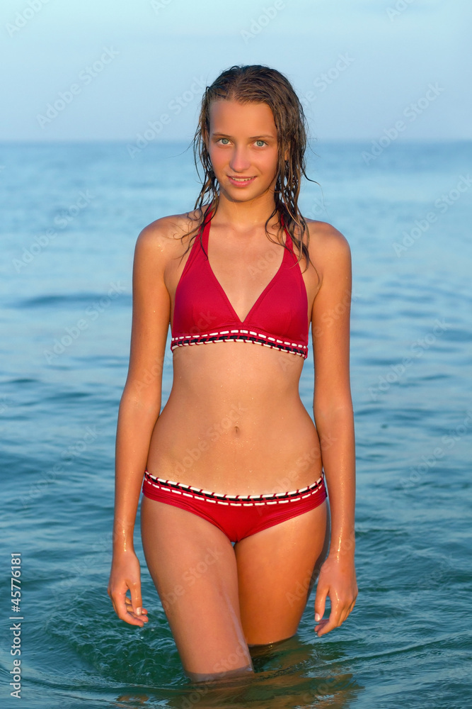 smiling teen girl in the sea smiling teen girl in the sea