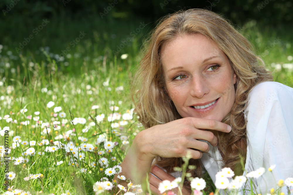 Woman lying in a meadow Woman lying in a meadow