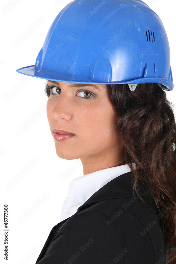 Woman wraing suit and hardhat Woman wraing suit and hardhat