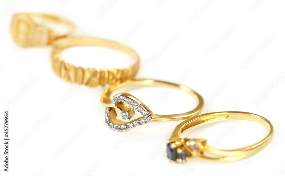 Four engagement rings with selective focus Four engagement rings with selective focus