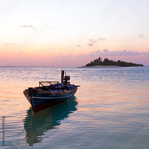 Romantic Tropical Sunset and Vintage Boat, Maldives © Rostislav Ageev