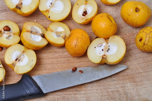 Quince fruits on the board, cut ready for processing photo