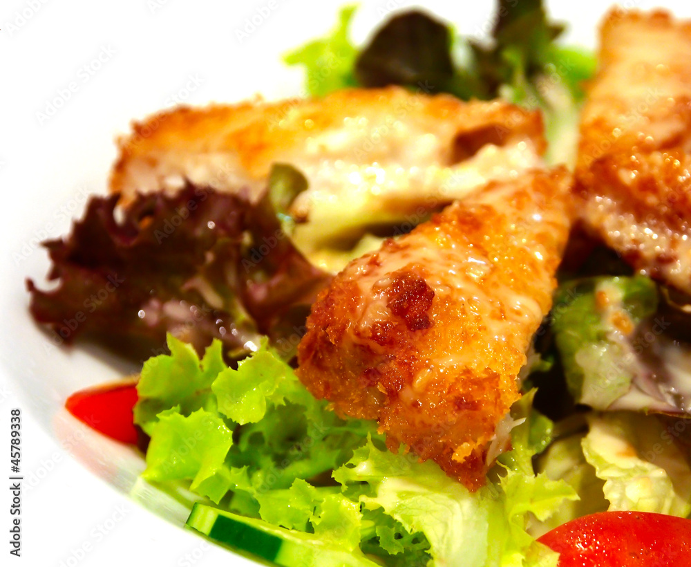 fried fish salad on white background fried fish salad on white background