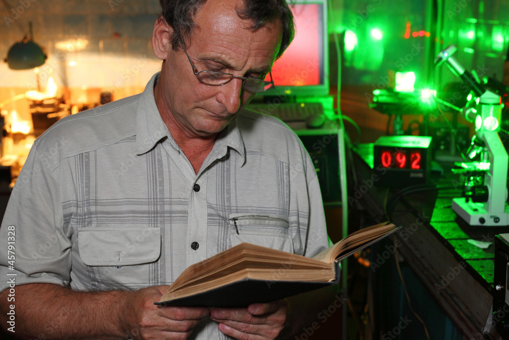 Scientist read in lab of movement of microparticles by laser Scientist read in lab of movement of microparticles by laser