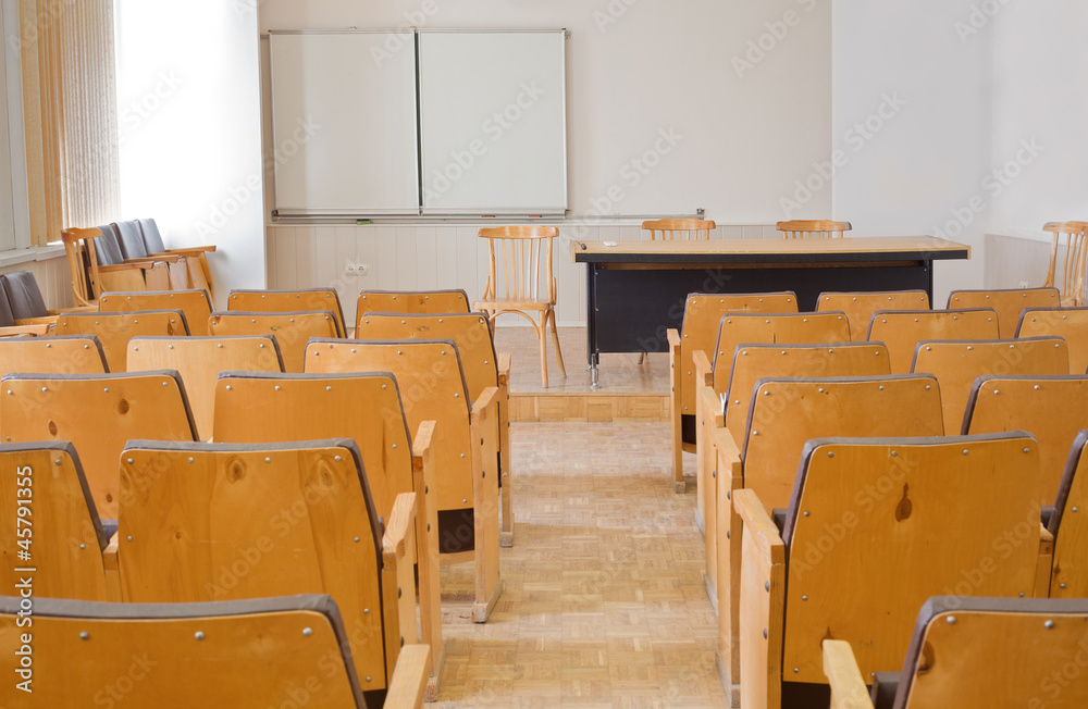 Empty conference room with chairs, blackboard