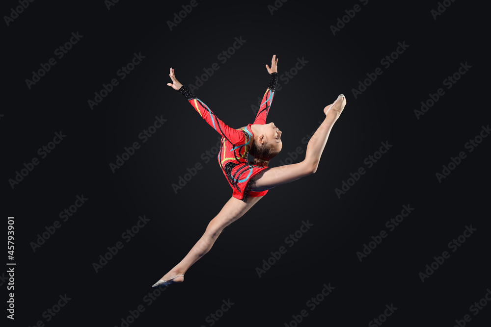 Fototapeta premium Young woman in gymnast suit posing