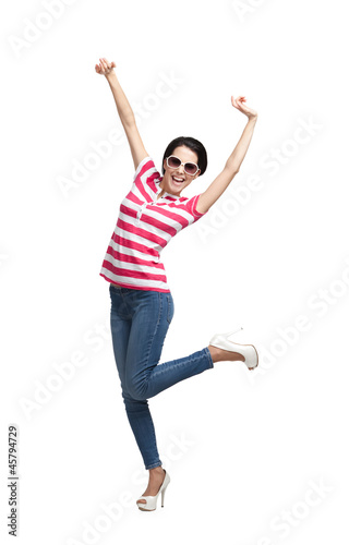 Happy dancing teenager with arms up, isolated