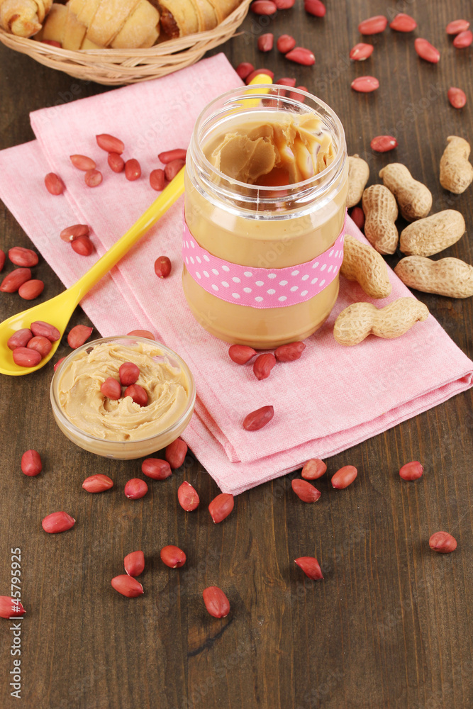 Delicious peanut butter in jar with baking Delicious peanut butter in jar with baking