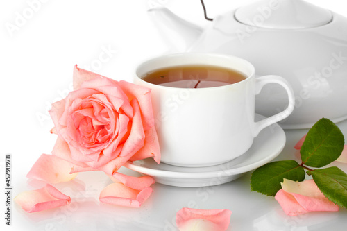 teapot and cup of tea with rose isolated on white