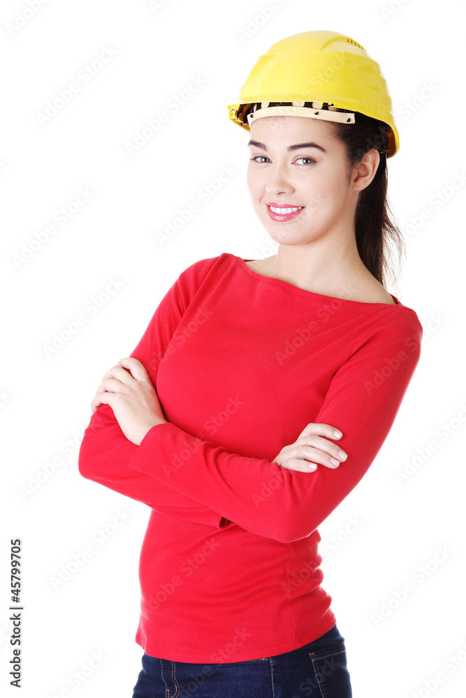 Portrait of confident female worker in helmet. Portrait of confident female worker in helmet.