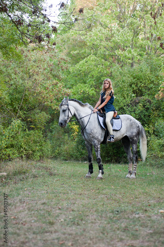 young woman with a horse outdoor