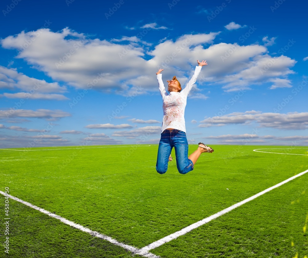 girl jumping on a football field girl jumping on a football field