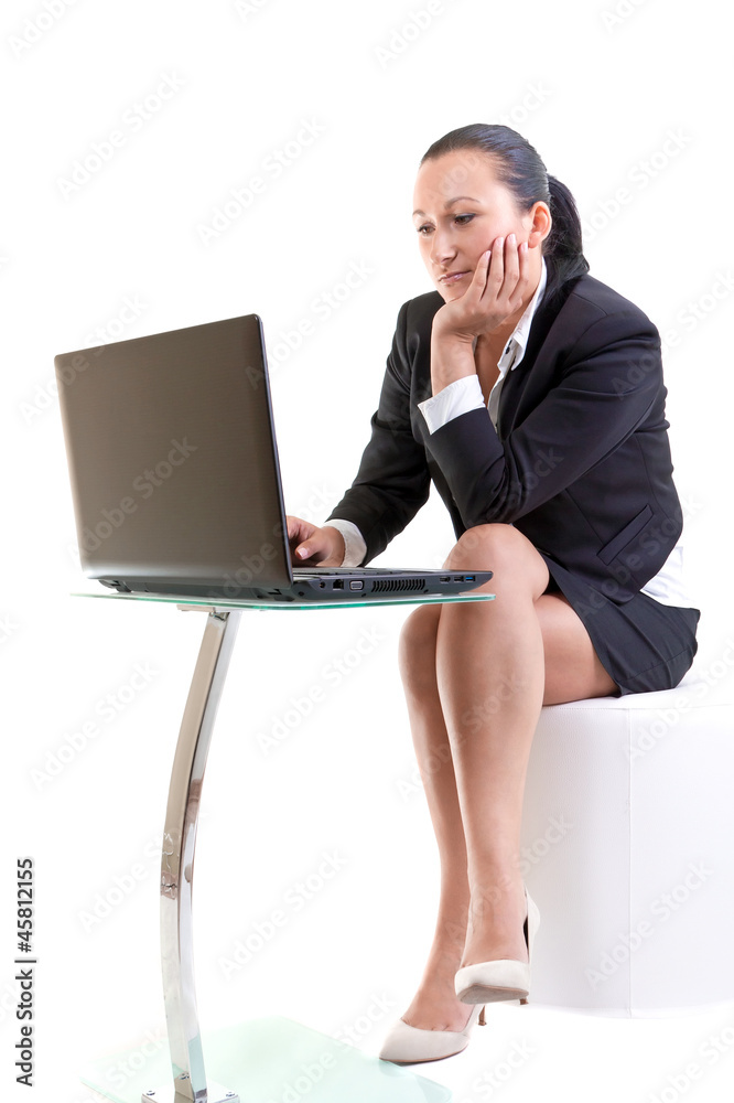 Brunette business woman working on the laptop Brunette business woman working on the laptop