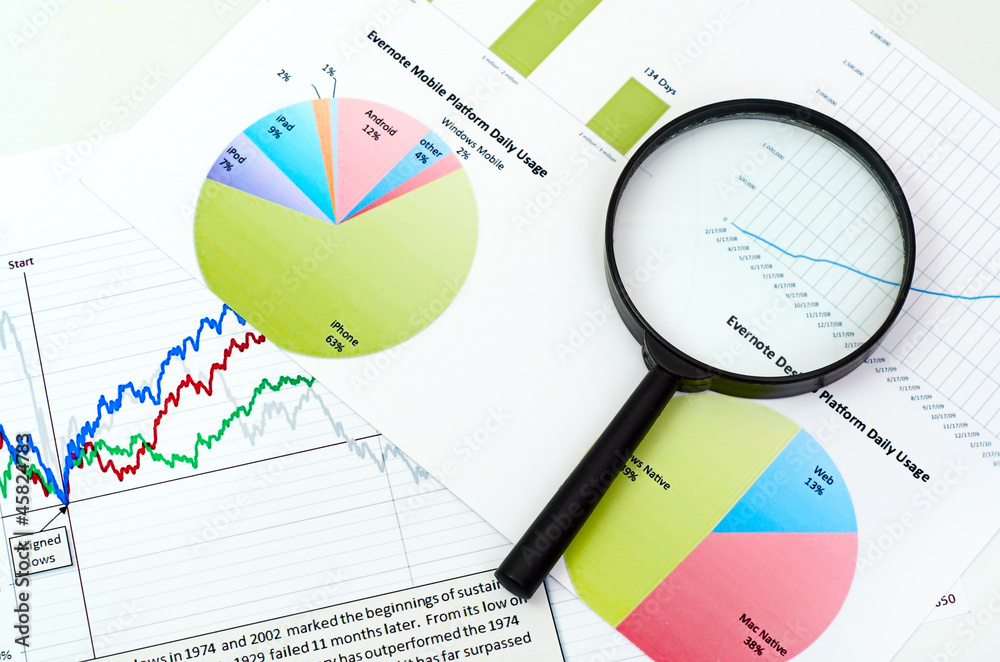 magnifying glass on graph business search magnifying glass on graph business search