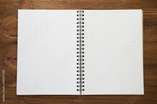 checked notepad on wood
