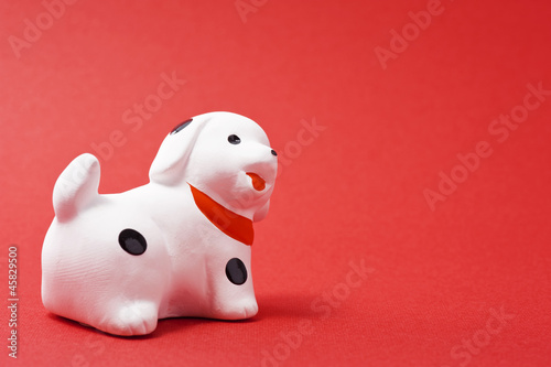赤色の背景に犬の干支置物stock Photo Adobe Stock