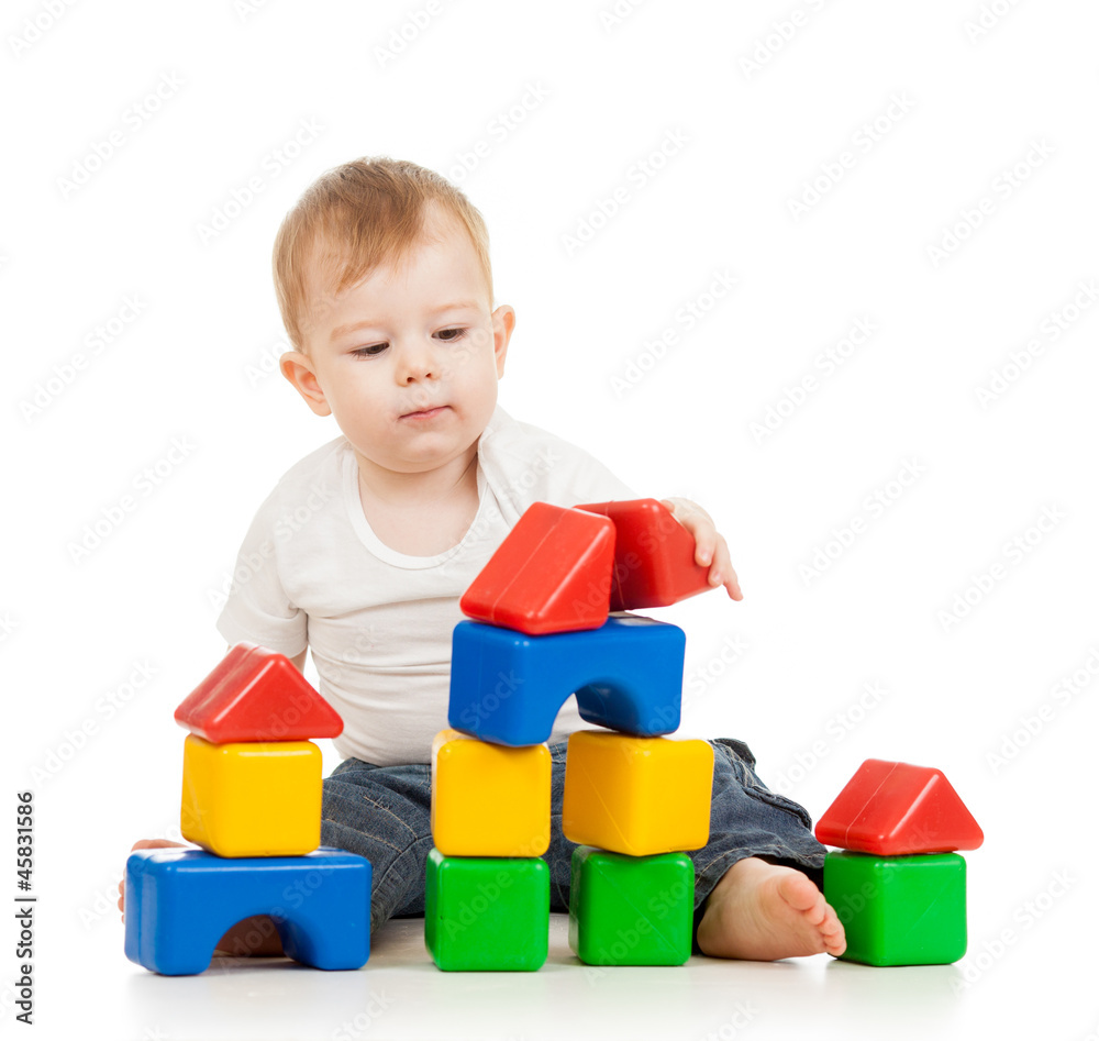 kid boy playing with construction set blocks isolated on white b kid boy playing with construction set blocks isolated on white b