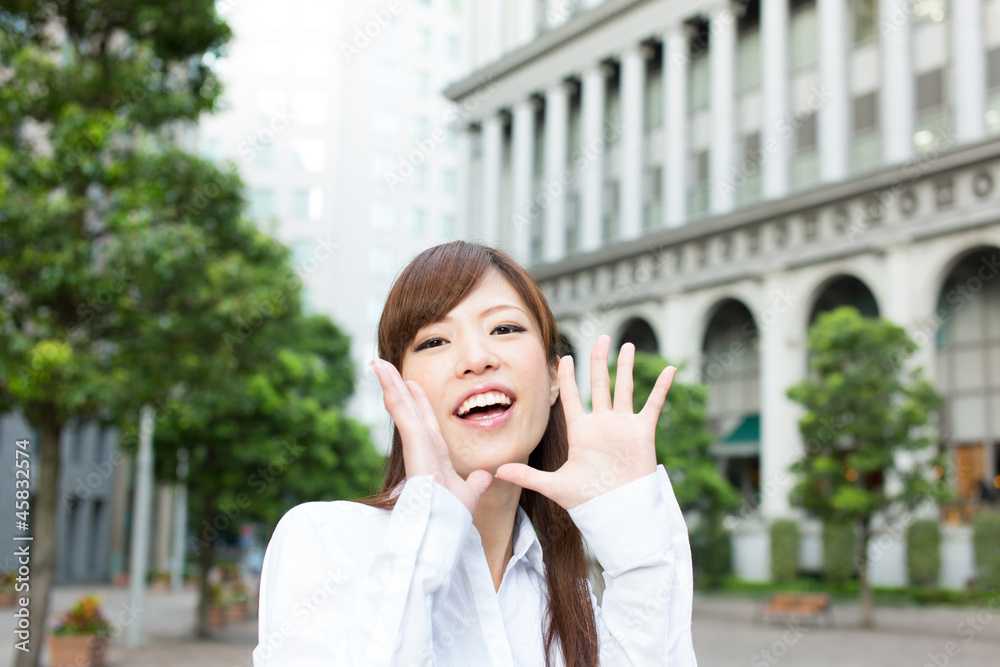 Beautiful business woman walking outside her office Beautiful business woman walking outside her office