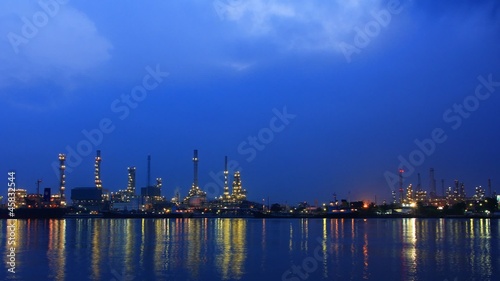 River and oil refinery factory with reflection