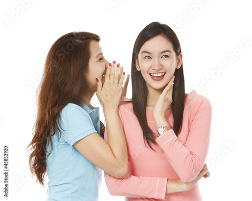 Young Women Whispering